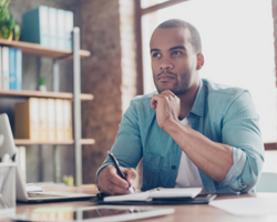 A man pondering about something, preparing to write something on his notebook (Success Through Failure episode 337: How You Do One Thing is NOT How You Do Everything)