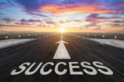 A runway with the word "success" written on the concrete (Success Through Failure episode 350: The Secret to Success That Nobody is Talking About and How to Leverage it for Outsized Results)