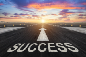 A runway with the word "success" written on the concrete (Success Through Failure episode 350: The Secret to Success That Nobody is Talking About and How to Leverage it for Outsized Results)