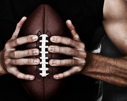 A man holding a football (The Duke) (Success Through Failure episode 389: Super Bowl Success: Failing Your Way to Becoming the Best in the World)