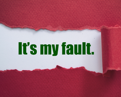 A red paper torn up that reveals the phrase, "It's my fault." (Success Through Failure episode 393: How to Catalyze Change (Regardless of How Successful You Are) Pt 1: The Hard Look in the Mirror and Taking Responsibility for Your Situation)
