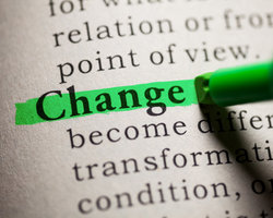 A person highlighting the word "change" in a dictionary (Success Through Failure episode 395: How to Catalyze Change Pt 2: External- Taking Responsibility for Your Situation)