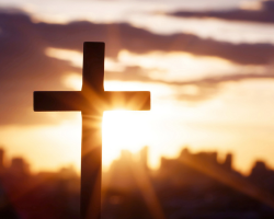 A cross shined upon by the setting sun (Success Through Failure podcast episode 416: God in the Arena: How Wrestling Paved the Way to My Spiritual Awakening)