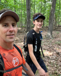 My son, Wyatt, and I doing the 24-hour Appalachian Trail Four State Challenge (Success Through Failure podcast episode 418: Best and Worst Takeaways of My Painful and Life-Changing Epic Adventure (And How to Create Your Own))