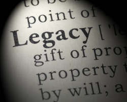 A photo of the word "legacy" from a dictionary (Success Through Failure podcast episode 420: What's Your Legacy? 9 Ways to Leave Your Mark on the World)